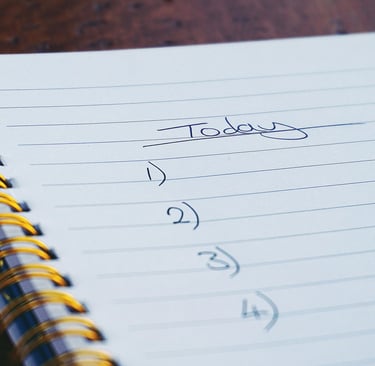 a notepad with a note pad and a pen on it