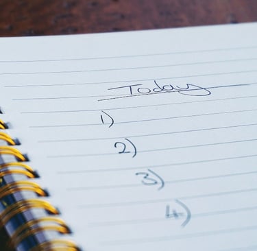 a notepad with a note pad and a pen on it