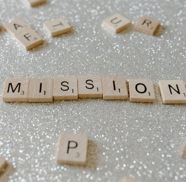 a close up of a wooden block with the words mission mission
