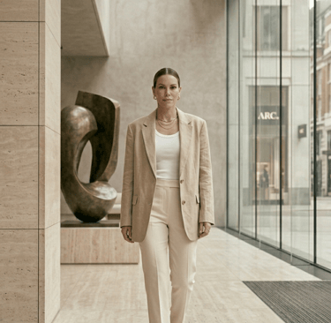Neutral basics outfit with cream tank top, tailored trousers and oversized blazer