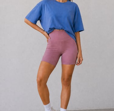 Biker shorts outfit idea for summer featuring oversized t-shirt styled for a casual athleisure look