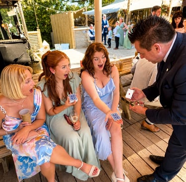 wedding magician Danny Hunt performing magic to wedding guests