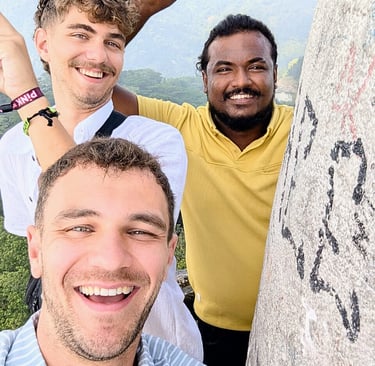 Two tourists traveling with a professional driver during an island-wide private tour in Sri Lanka.
