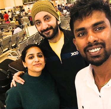Couple greeted by a friendly driver at Colombo Airport for a private transfer.
