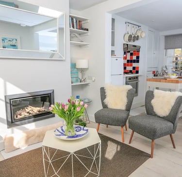 a living room with a fireplace and a fireplace