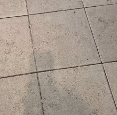 Top-down view of grey kitchen tiles