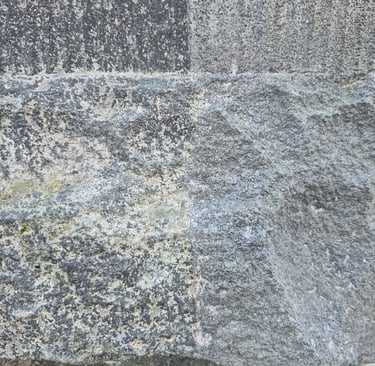 Basalt stone buiding detail partially restored with laser cleaner in Christchurch New Zealand