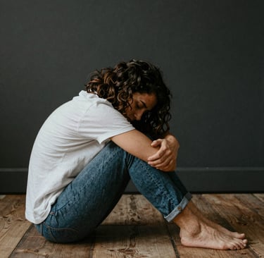 Damaged car bursts through a dark building wall