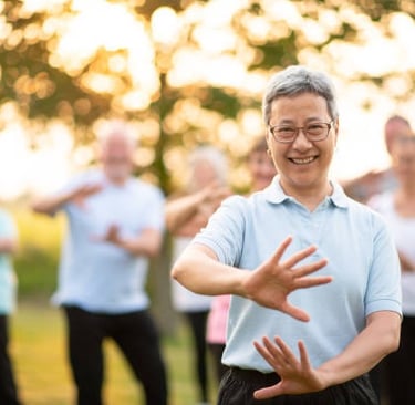 Group tai chi practice outdoors