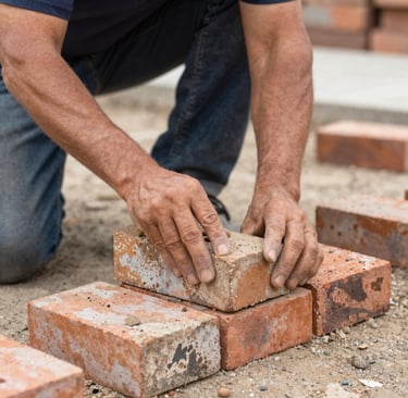Masonry contractor laying bricks for retaining wall