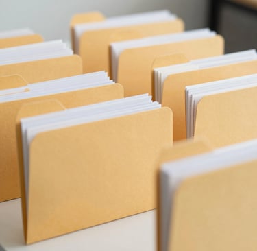 Organized rows of file folders for transaction coordinaotr