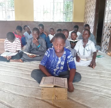 Young Muslim students reciting Quran in Maakitheena Foundation classroom