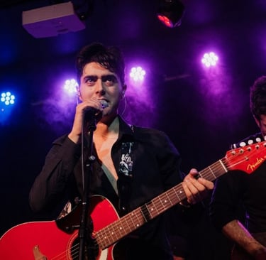 Brighton rock singer Olly Williams performing live with band