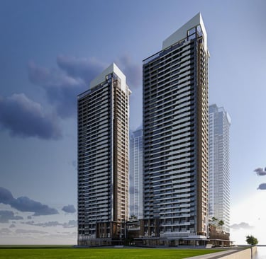 Modern luxury high-rise residential towers with glass balconies and architectural rooftops under a blue sky.