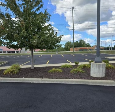 shows a freshly sealcoated and striped bank parking lot in Rocky River
