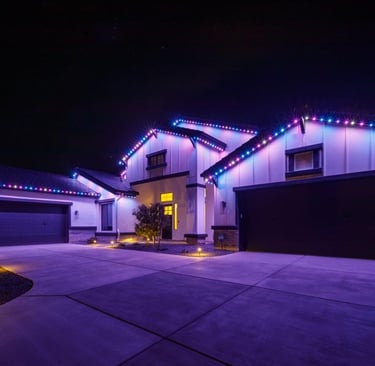 Bright holiday permanent lights on a house for a festive holiday display.