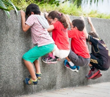 Kids playing parkour outdoors