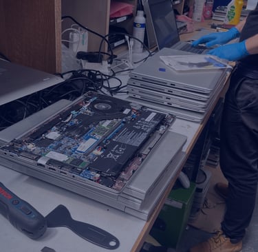 A TTB CircularIT employee refurbishes a batch of data-erased laptops
