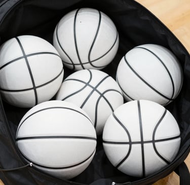 A vibrant photo of kids joyfully painting official-size basketballs with bright colors and dripping paint effects.