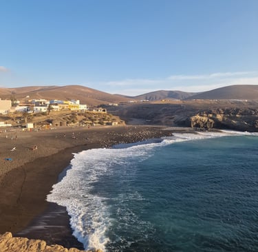 a beach with a view of a beach and a blue sky