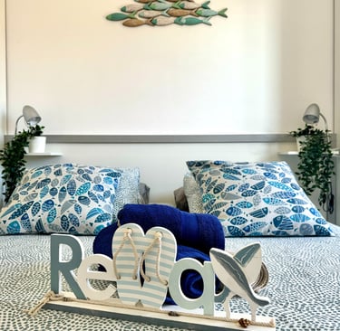 a bed with a wooden sign that says love