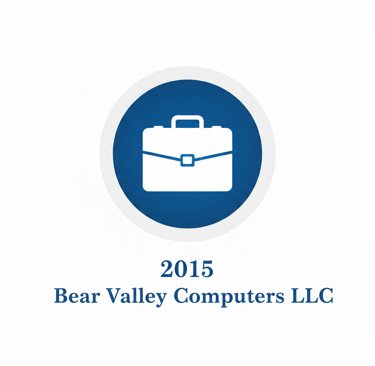 Bear Valley Computers LLC 2015 logo featuring a white briefcase icon inside a blue circular badge.
