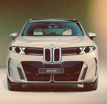 Front view of a silver BMW X5 luxury SUV concept featuring a modern illuminated kidney grille and sleek LED headlights.