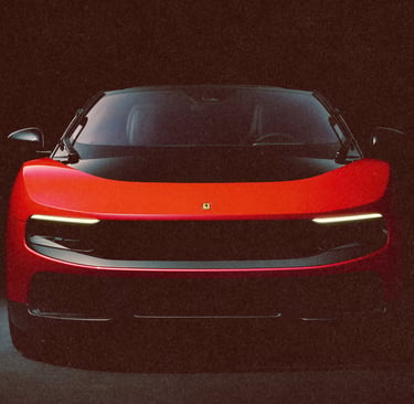 Front view of a sleek red Ferrari luxury sports car with headlights on against a dark background.