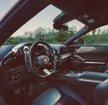 Interior view of a Ferrari Purosangue featuring a luxury leather cabin and carbon fiber dashboard.