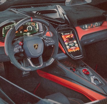 Luxury interior of a Lamborghini featuring red leather trim and digital dashboard.