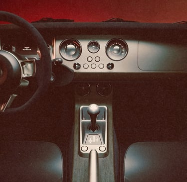 Luxury Morgan sports car interior featuring a modern dashboard, analog gauges, and leather seats.
