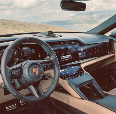 Luxury interior of a modern Porsche Cayenne featuring digital dashboard displays and leather seats.