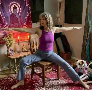 Image of woman doing Warrior 2 on a chair.