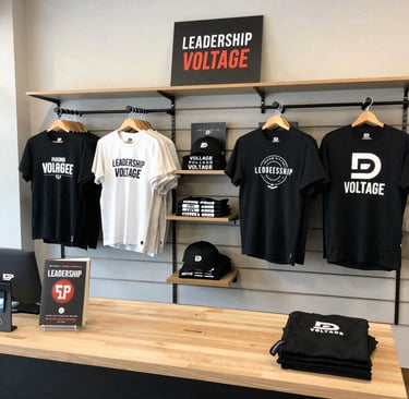 A colorful display of Danielle’s branded apparel and journals arranged neatly in the online store setting.