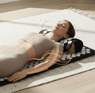 Woman using RecoverX acupressure mat for sciatica pain relief on floor