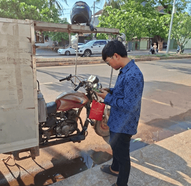 alt="Local courier preparing an Angkor Herbal Solutions package order for fast local shipping"