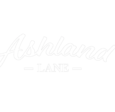 White Ashland Lane script logo with a minimalist black background for a modern brand identity.