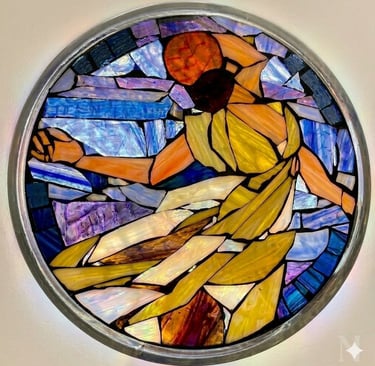 Circular stained glass mosaic titled "Isadora" by Julie Curson, depicting a graceful figure.