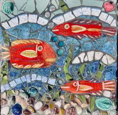 Whimsical underwater scene mosaic stepping stone with bright red fish by artist Julie Curson