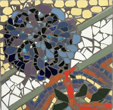 Blue floral mosaic stepping stone with intricate colorful ceramic details. by artist Julie Curson