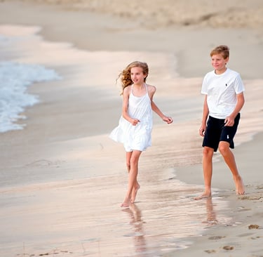 Siblings enjoy Cottesloe Beach at sunset Fisher Photography Beach Photos