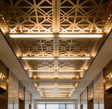 Luxury elevator lobby featuring gold geometric laser-cut ceiling panels with integrated LED lighting.