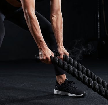 Man in headphones boxing under a bridge