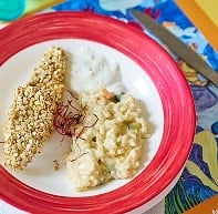 Filet de bar pané aux céréales, risotto de légumes, crème citronée et herbes