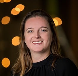 a woman in a black top and a white shirt