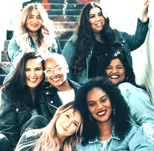 a group of women sitting on a couch
