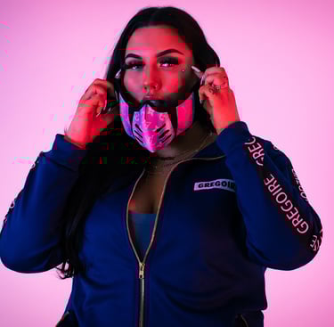 a woman in a blue jacket and a pink mask