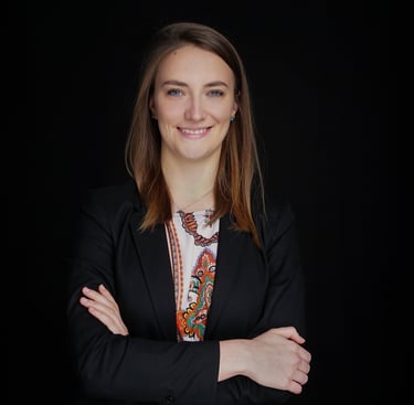 a woman in a suit and a black jacket