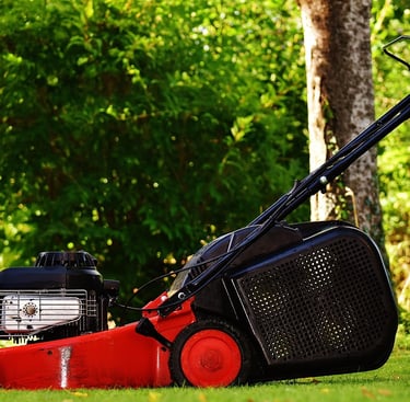 Professional lawn mower cutting grass on a residential property in Guelph, Ontario