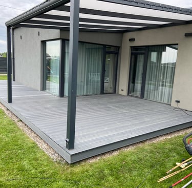 a patio with a deck and a lawn chair